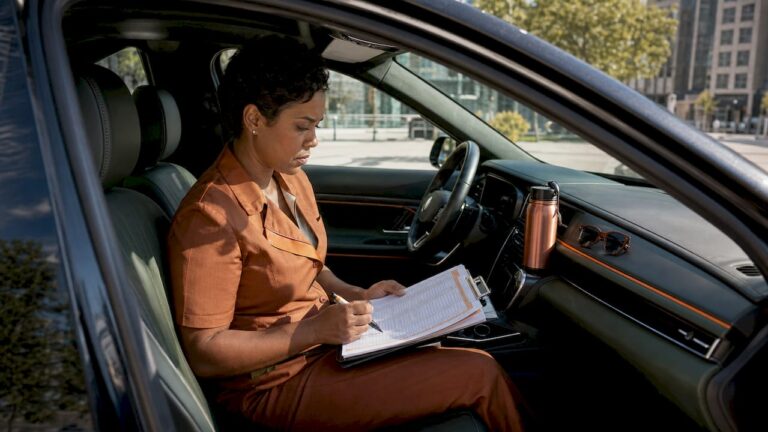 Personal driver reviewing daily schedule clipboard