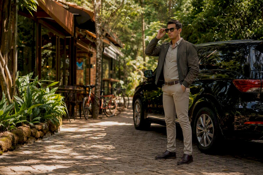 Driver waiting by vehicle near Iguazu park